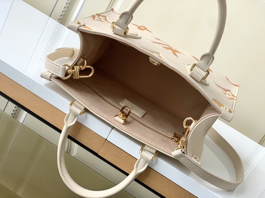 Het Reuzemonogram OnTheGo van de roomsaffraan de HEREN Louis Vuitton Messenger Bag For Ipad Mini